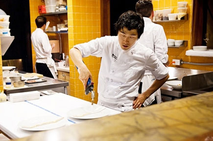 Asian chef busy cooking in the kitchen