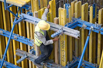 Hardworking man using safety helmet