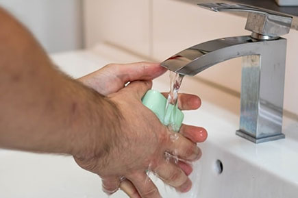 Wash hands with green soap