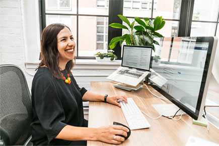 Happy woman working at her desk.