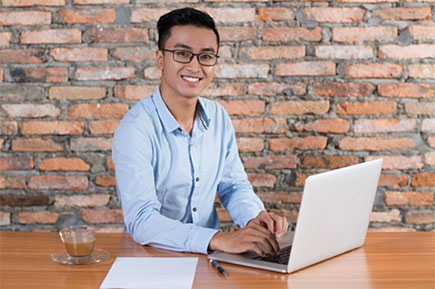 Happy Asian man working