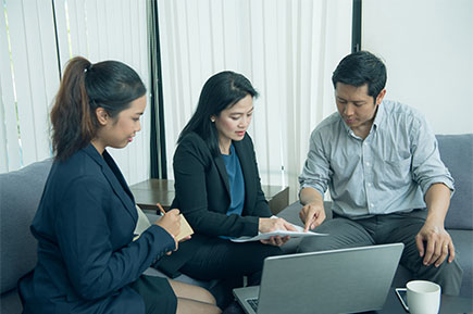 Employees discussing business plan