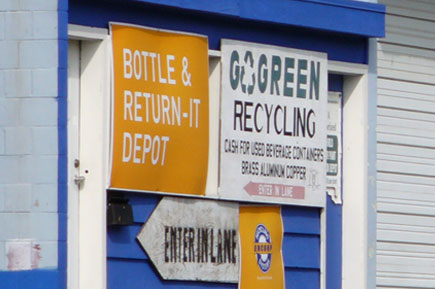 Go Green recycling poster outside a building in Singapore.